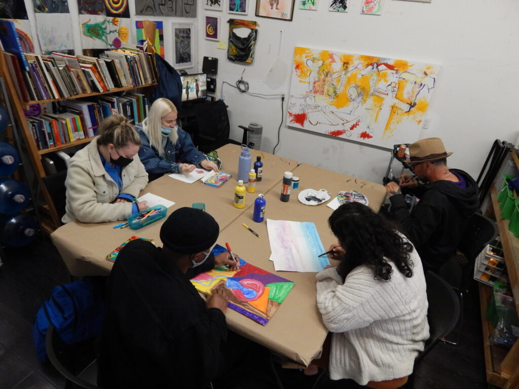 Five people in the Painted Brain Community Center in an Art Activity Group