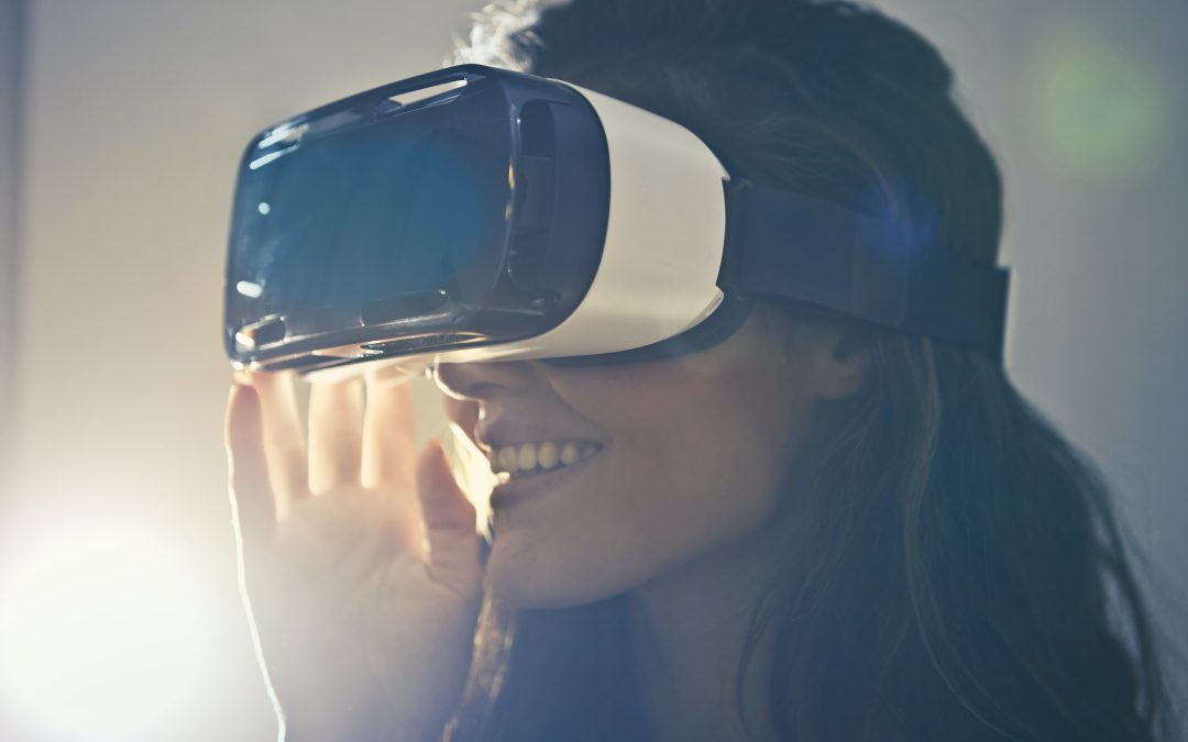 A woman wearing a Virtual Reality headset: