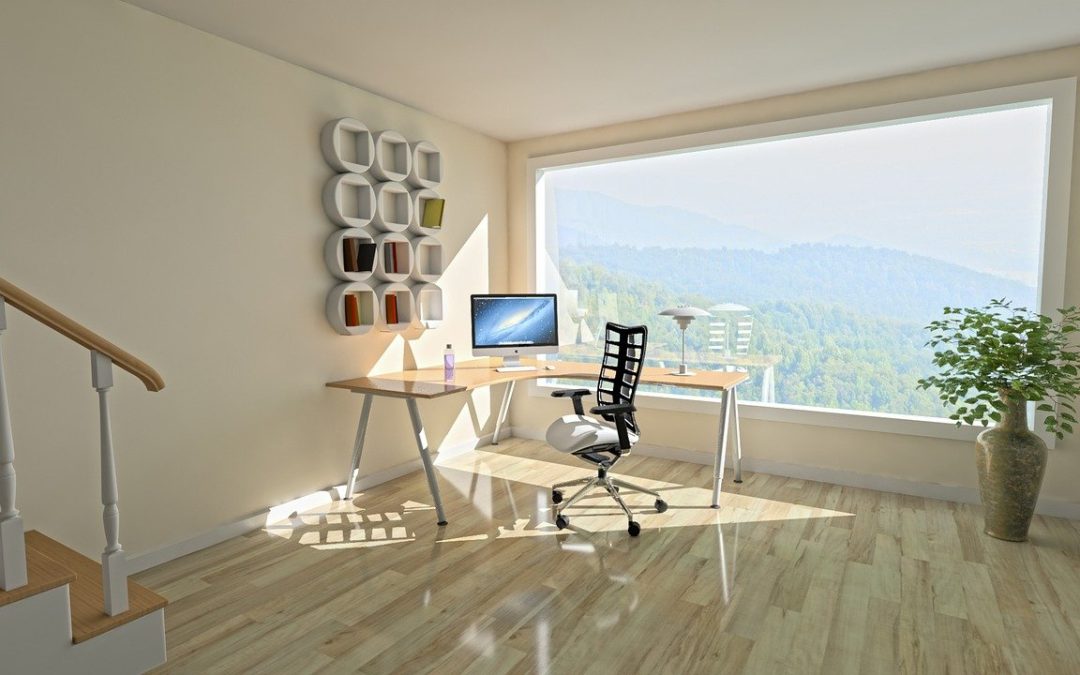 Creating inspiring space in our room: An office with a computer and desk overlooking a window
