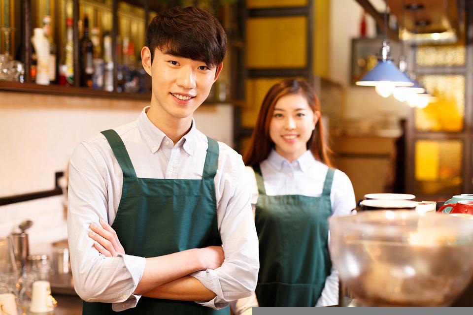 A waitress and a waiter in a restaurant
