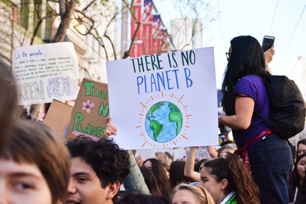 Climate change: A person at a street rally holding a sign saying there is no planet B