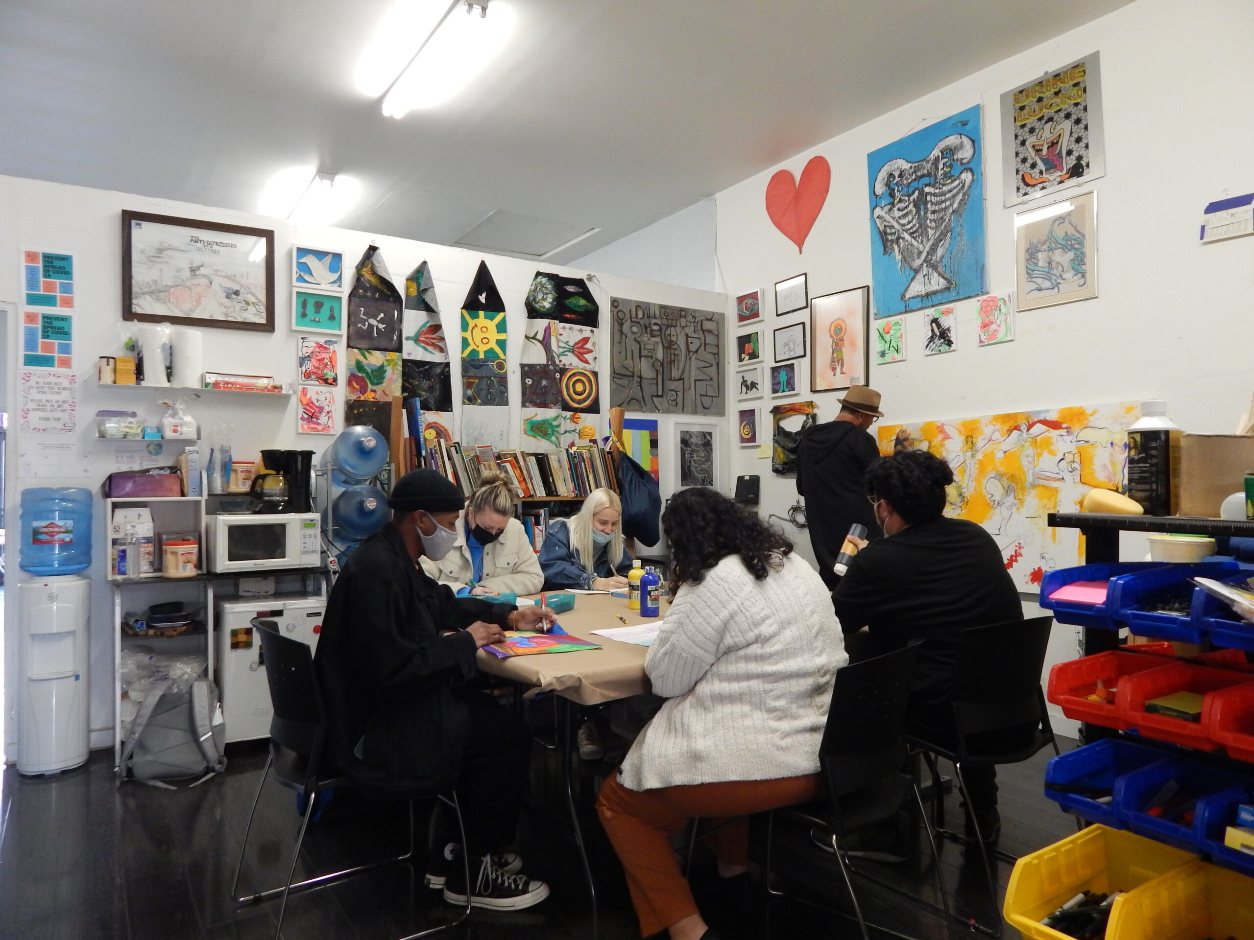 A crowded community center back room art group space 2
