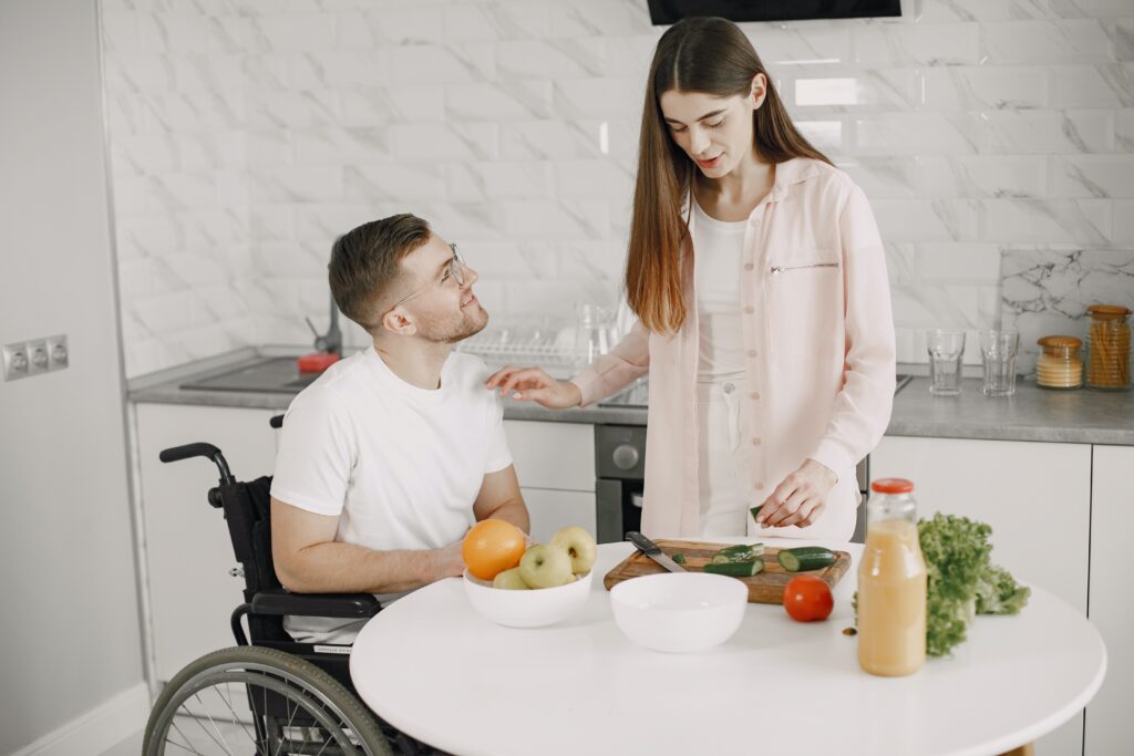 Man and woman preparing food in the kitchen