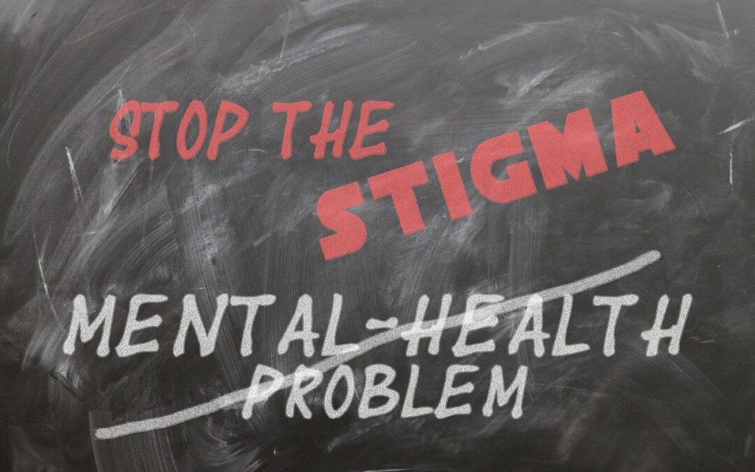 Black board saying stop the stigma and a line through the words "mental health problem"