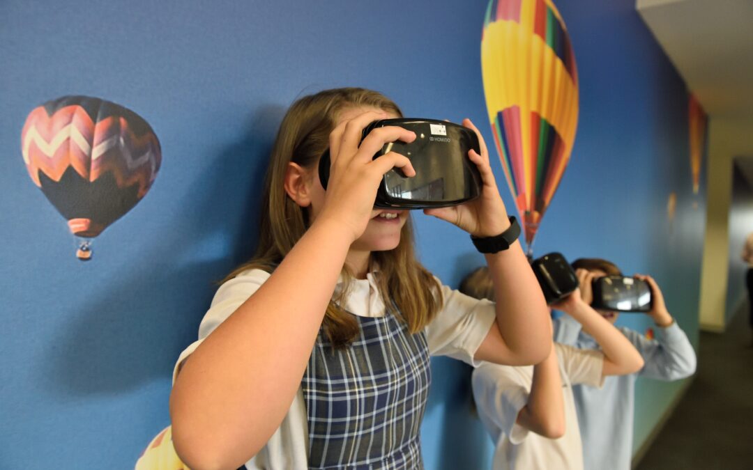 Learning Happy Students in School wearing a virtual reality headset Middle School