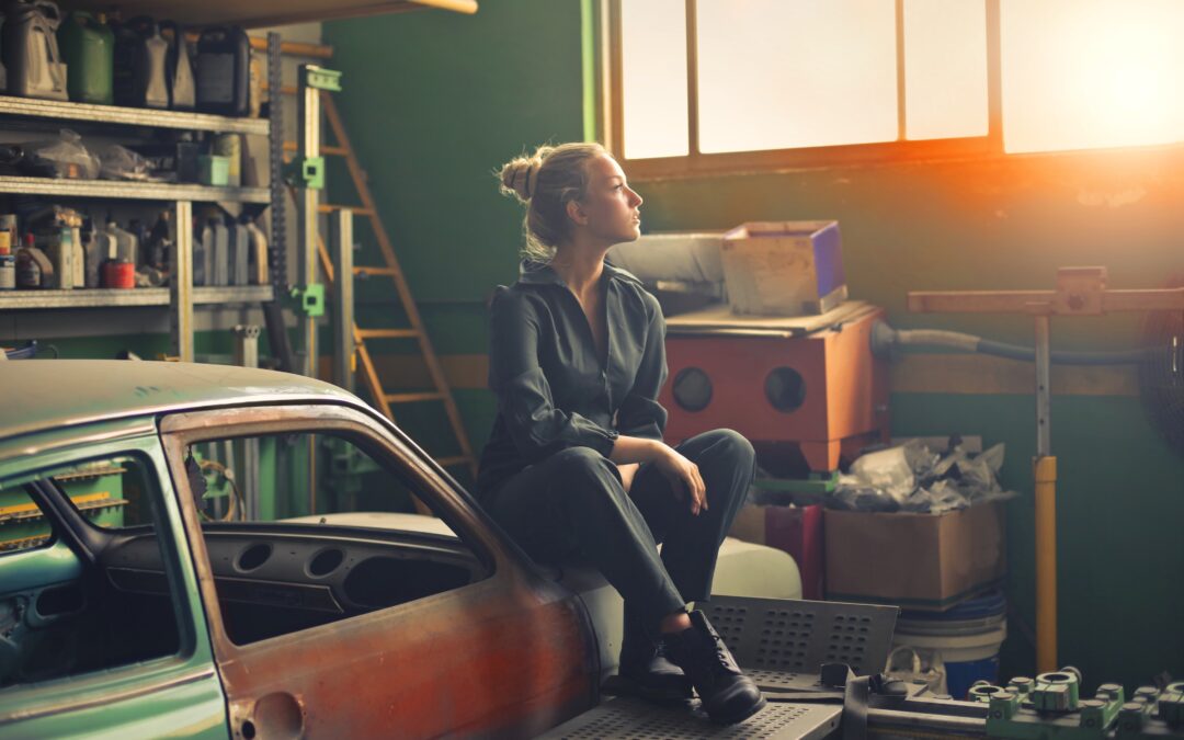 Woman in garage staring out window