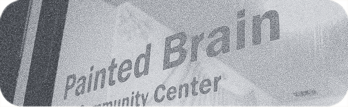 imager of the Painted brain's community center window showing the words Painted brain community Center